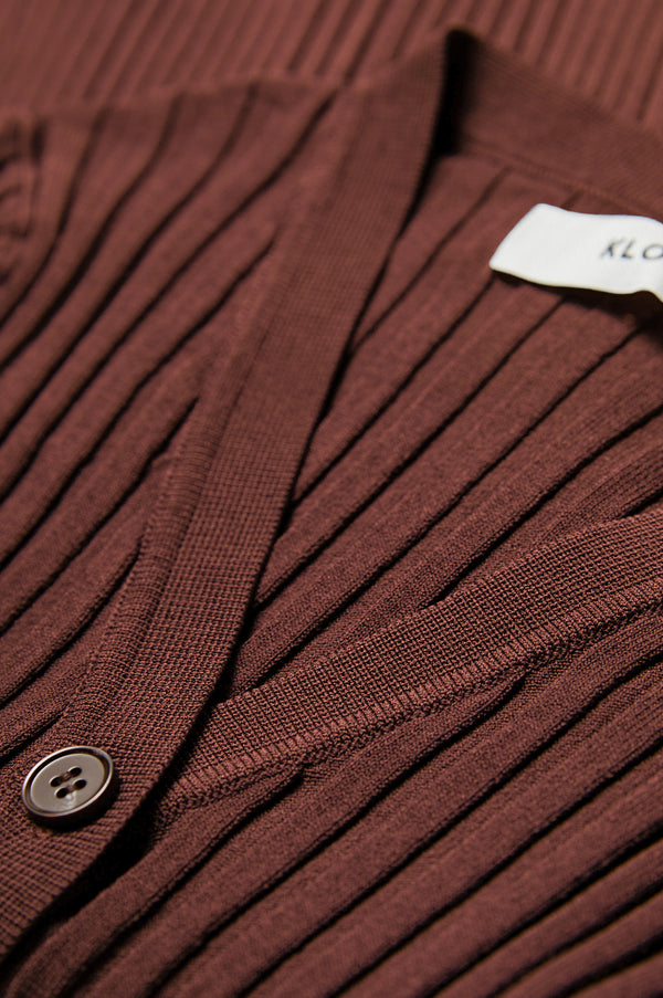 Close up of the rib texture detail of the Delay Short Sleeve Knit in rich cocoa brown made from 80% Viscose, 20% Nylon.