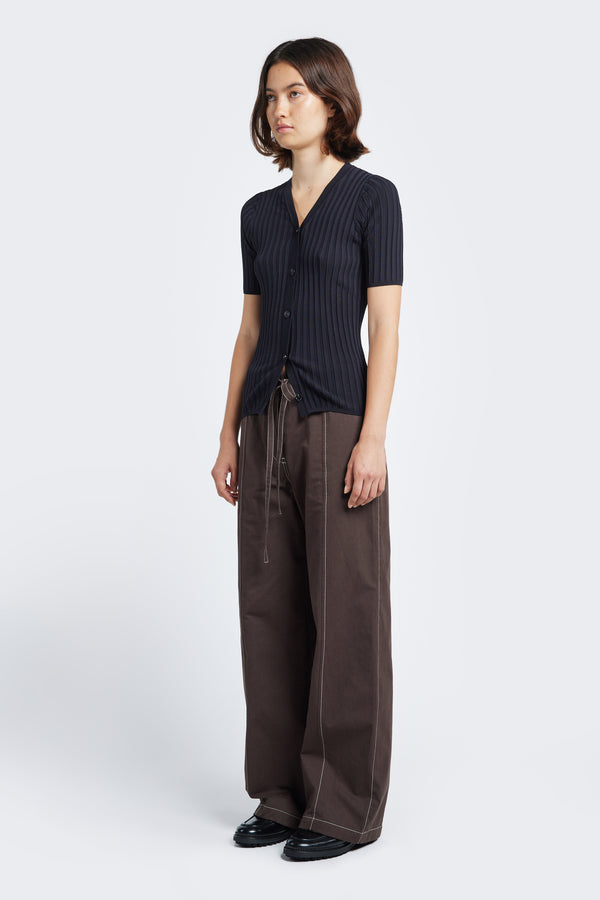 The Delay Short Sleeve Knit in Ink, a slim fit short sleeve V neck button up knit in a rib texture detail styled with the Found Tie Front Pant Brown.