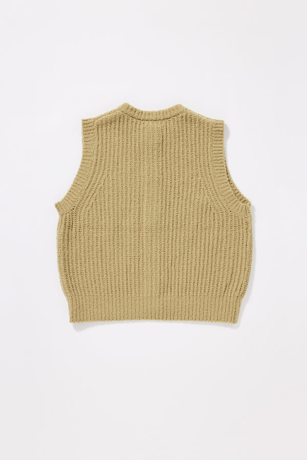 Back of Chartreuse Faint Knit Vest worn buttoned over a Top, showing sleeveless cut, 1x2 rib sleeve openings and reverse half-cardigan rib knit in RWS Merino