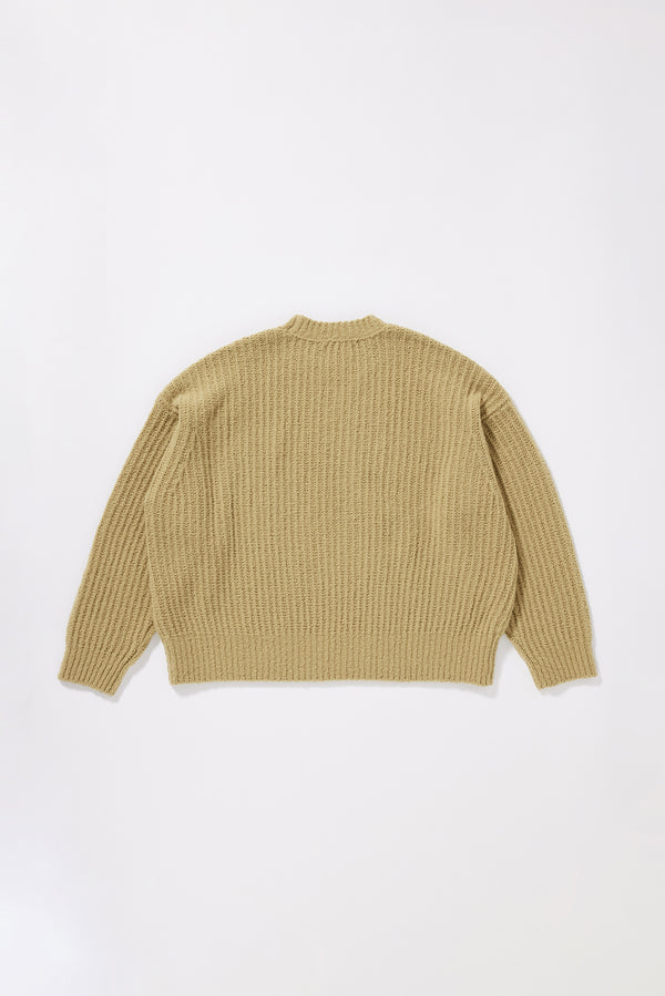 chartreuse Flutter Sweater back view showing chunky reverse half-cardigan rib knit construction, dropped shoulders and relaxed raglan sleeve silhouette