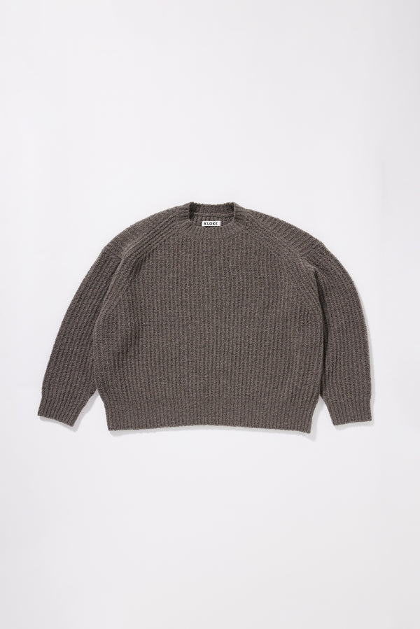 Pale Pewter  Flutter Sweater front view showing chunky reverse half-cardigan rib knit construction, dropped shoulders and relaxed raglan sleeve silhouette