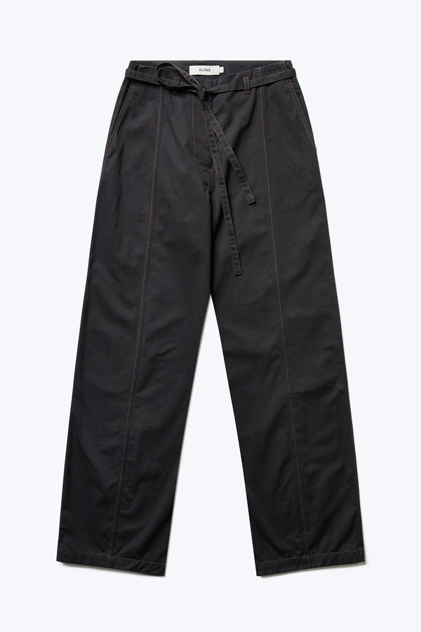 The front of the Found Tie Front Pant Black with brown stitching. These relaxed, straight-leg pant has a waist tie and diagonal seam pockets at the front. These casual pants are crafted from a durable cotton.