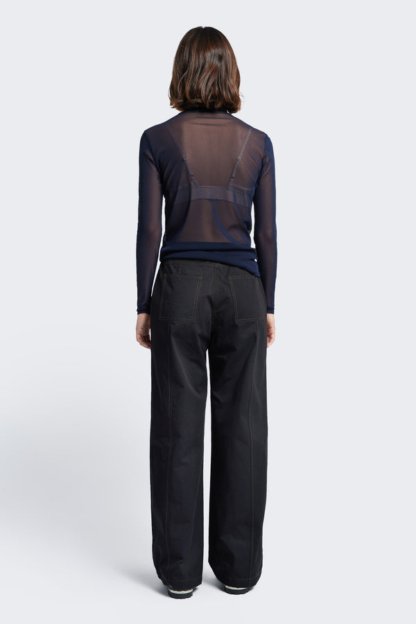 The back of the Found Tie Front Pant Black with Brown Stitch. These are a relaxed, straight-leg pant with patch pockets at the rear.