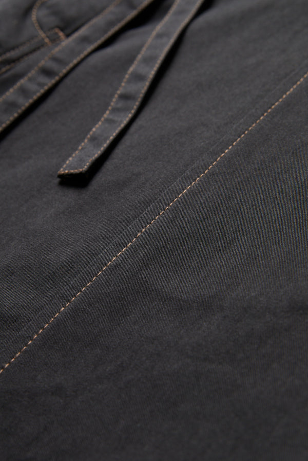 Close up of the brown contrast stitching on the Found Tie Front Pant Black. Crafted from 100% cotton. 