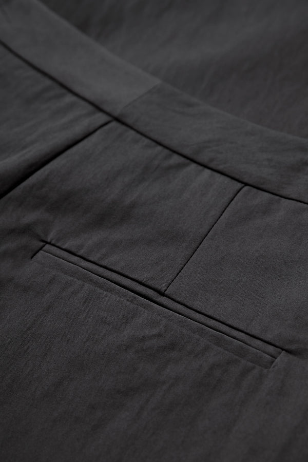 Close up of the Grace Pant Black tailored welt pockets at the rear.