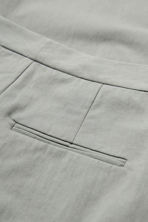 Close up of the Grace Pant Grey tailored welt pockets at the rear.