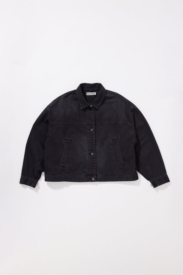 Flat front of the black fade Oversized denim jacket with wide sleeves, deep welt pockets and a vintage-inspired over-dyed wash.