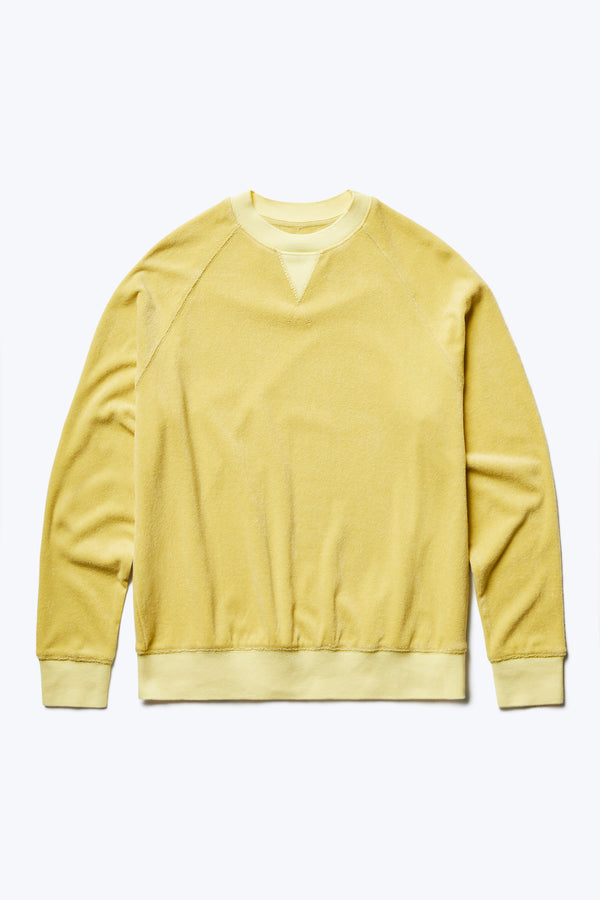 The front of the Hero Towelling Sweater Butter, a sweater inspired by an old-school track-and-field pedigree. Made from plush, 100% cotton Okeo-tex standard 100 micro terry-towelling. Available in five sizes. 