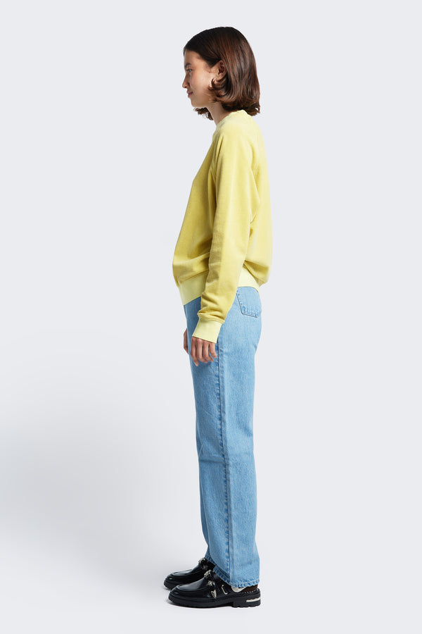 Side profile of the Hero Towelling Sweater, a sweater inspired by an old-school track-and-field pedigree with a relaxed fit. Made from plush, 100% cotton Okeo-tex standard 100 micro terry-towelling in butter. 