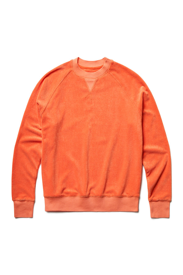 The front of the Hero Towelling Sweater Tangerine, a relaxed fit sweater inspired by an old-school track-and-field pedigree. Made from plush, 100% cotton Okeo-tex standard 100 micro terry-towelling with rib band trim, V insert, flatlock stitch and raglan coverstitched sleeve.