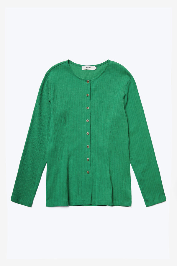 The front of the Hideout Crinkle Top Green, a slim fit style with darted waistline and straight hem. Featuring a centre front button through and round crew neckline. Made from a special crinkle fabric that is textured.