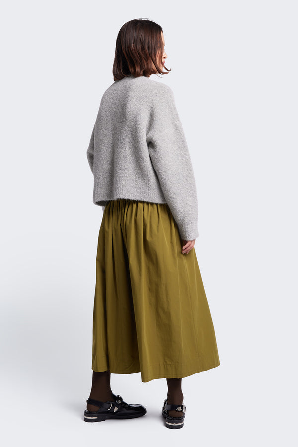 The back of the Hold Shearling Sweater Soft Grey, this shearling knit is made from an Alpaca blend. The dropped shoulder and crop hem give this sweater a flattering silhouette. 