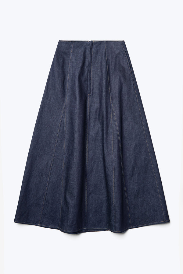 Flat lay of the back of the Idle Denim Skirt Indigo, a full godet style skirt with contrast topstitch and a centre back zip closure. Made from Japanese Denim. 