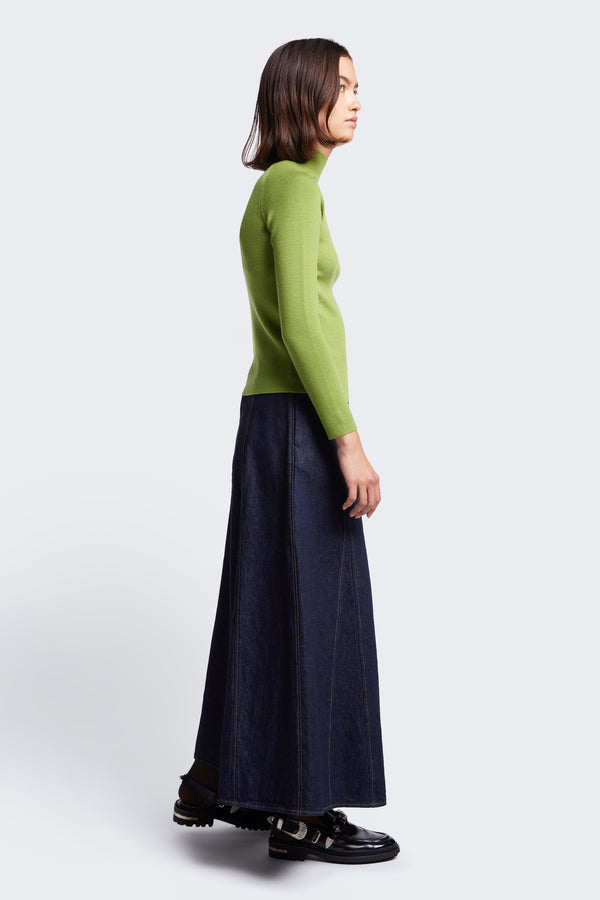 Side profile of the Idle Denim Skirt Indigo, a godet style skirt crafted from Japanese Denim.