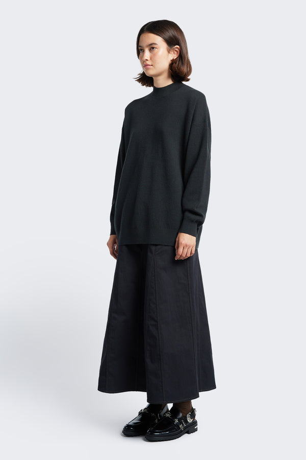 The Idle Skirt Black, is a godet style skirt with contrast stitch details.