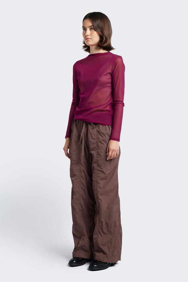 The Inland Pant Cocoa Brown, is a light, loose fit pant featuring seam detail and elasticated waistband with tie. These textured pants are made from 100% Nylon. Available in five sizes. 