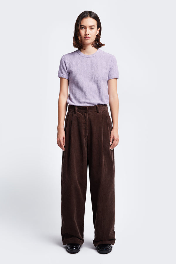 The Interim Cord Pant Dark Brown, a semi-tailored cord pant with a generous and flattering double-pleated fit. A comfortable and smart alternative when jeans won’t cut it.