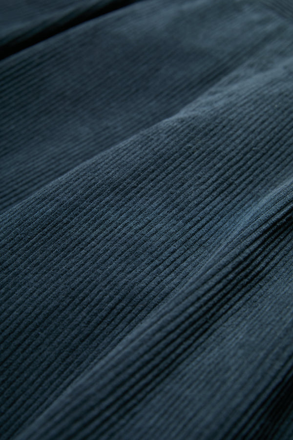 The Interim Pant corduroy fabric in Petrol Blue.