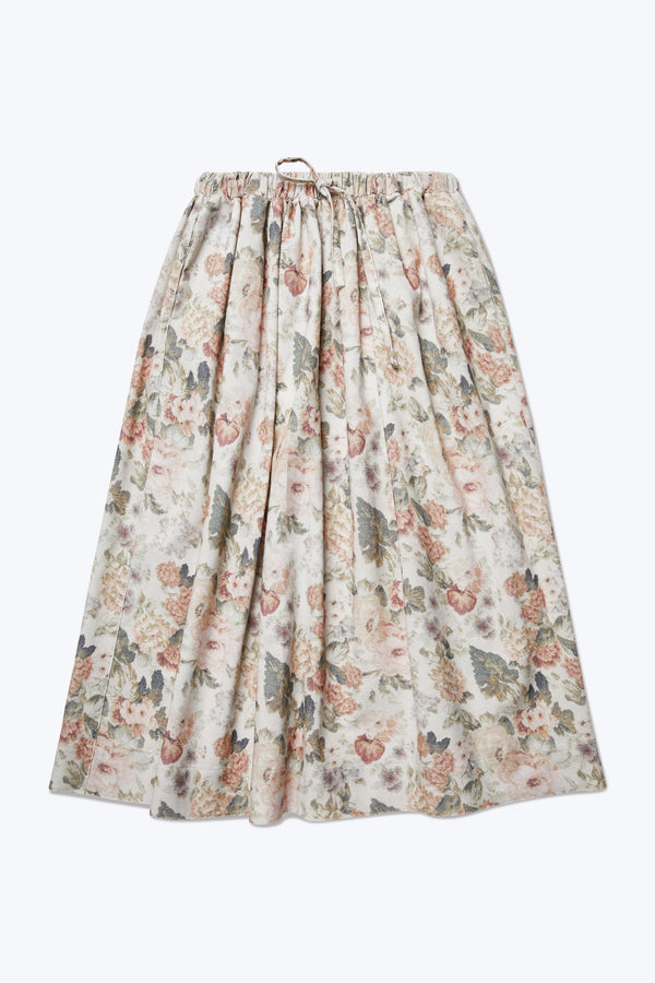 The Interlude Skirt is a full gathered skirt with an elasticated waistband with centre front self tie and two front welt pockets. Crafted in a fine wale cotton corduroy in floral print.