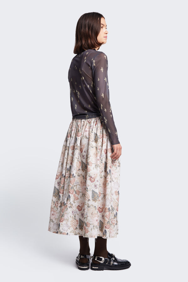 The back of the Interlude Skirt Floral, a mid-length, full gathered skirt with an elasticated waistband skirt crafted in a fine wale cotton corduroy in floral print. Available in five sizes. 
