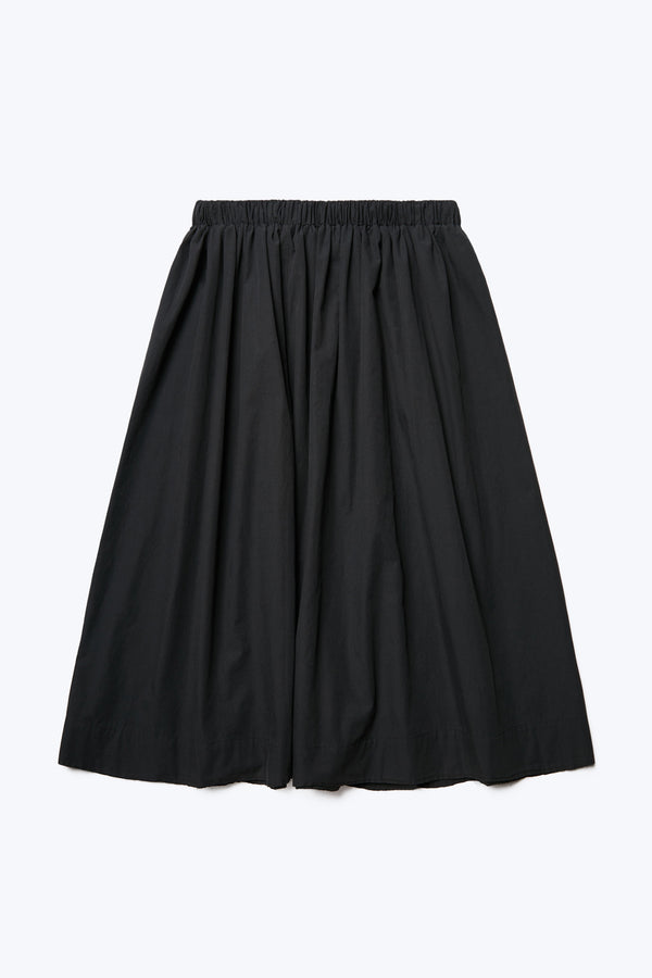 The back of the Interlude Skirt, a full gathered skirt with an elasticated waistband. Made from 100% cotton in Black. 