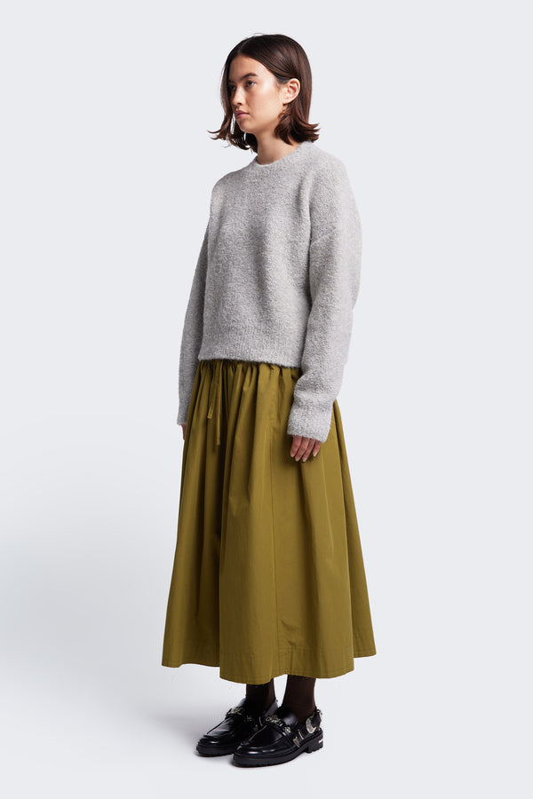 The comfortable Interlude Skirt Moss Green made from 100% cotton. A full gathered skirt with an elasticated waistband with drawstring for an adjustable fit. 