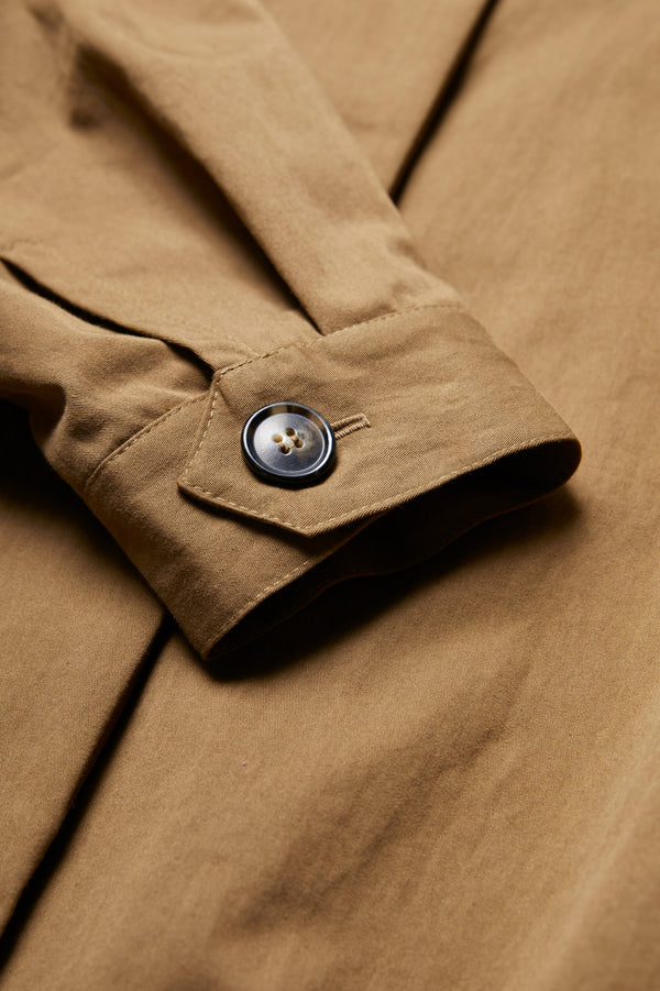 Close up of the cuff sleeve opening on the Embark Jacket Tan. This jacket is made from 55% Nylon, 40% Cotton, 5% Tencel.