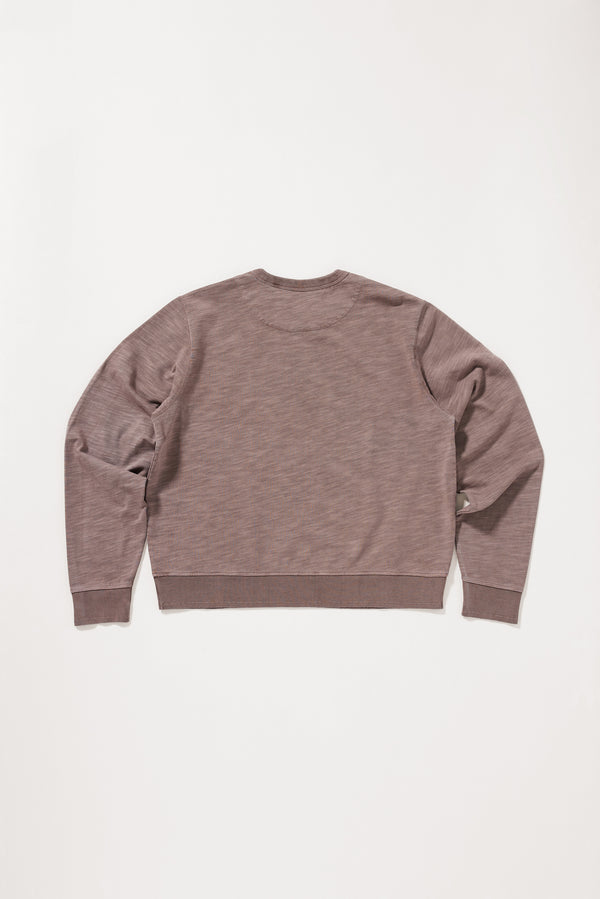 flat back view of the brown Luster Long Sleeve Top showing the cropped fit and relaxed silhouette.