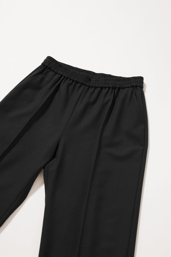 Close-up of the front pin tuck detailing on the Black Manta Pant.