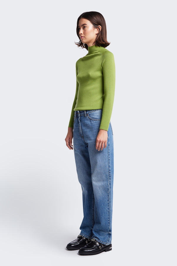 The Monument Mock Neck Sweater made from Merino wool in Apple Green. This slim fit sweater with a 1 x 1 rib stitch is an excellent layering option. 