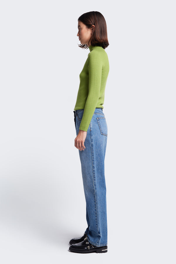 Side profile of the slim fit Monument Mock Neck Sweater in Apple Green, knitted from Merino Wool.