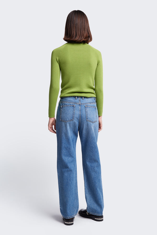 The back of the Monument Mock Neck Sweater, a slim fit knit made from Merino Wool in Apple Green. 