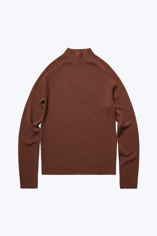 The front of Monument Mock Neck Sweater Brown. This slim fit sweater knitted in Merino Wool is an excellent layering option for the colder months. 