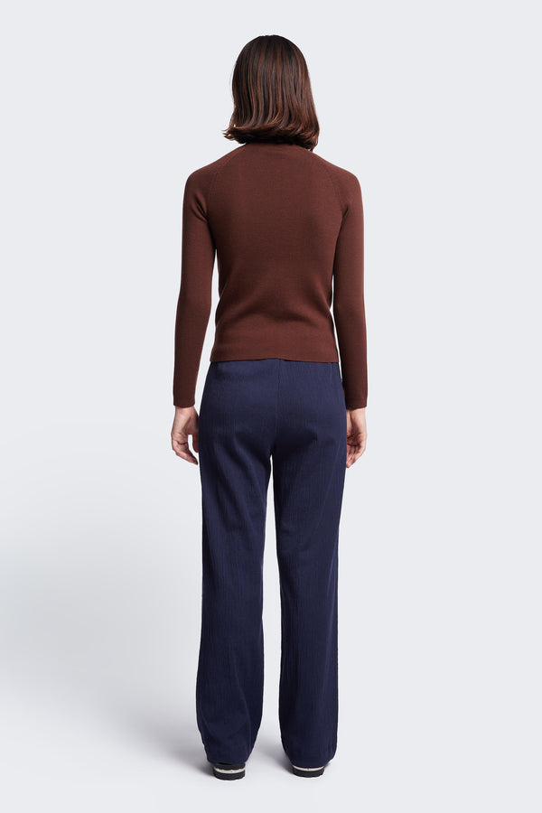 The back of the Monument Mock Neck Sweater, a slim fit knit made from Merino Wool in Brown. 