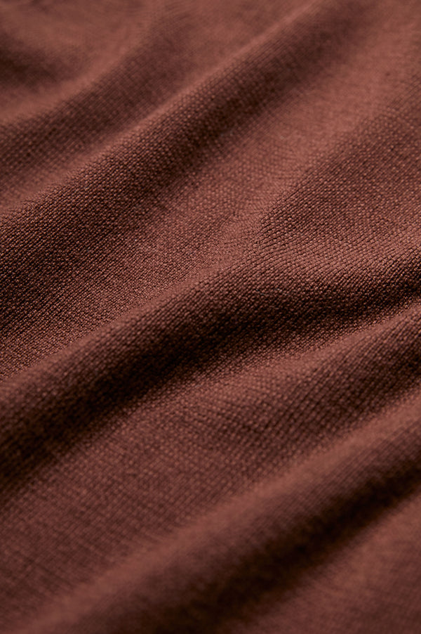 The Monument Mock Neck Sweater is knitted in Merino wool in Brown for a luxurious feel. 