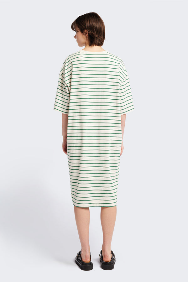 The back of the Nadir Dress, a laid-back style made from pure cotton jersey with green stripes. This dress features side-splits, dropped shoulder, and up-sized elbow-grazing sleeves