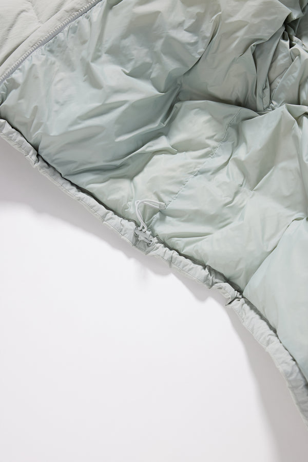 Close-up of quilted stitching inner detail on the grey Nimbus Kimono Jacket, filled with high-loft recycled post-consumer down