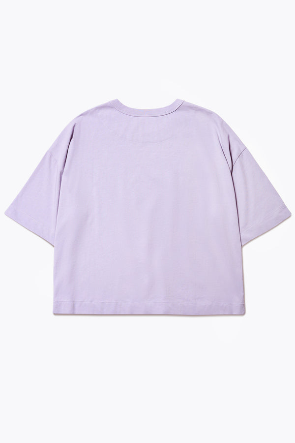 The back of the Obelisk T-Shirt Lilac. Cut from high-grade cotton with an  extra thick 1 x 1 rib bound cover stitched neckline, straight hem, and side-slit detail.