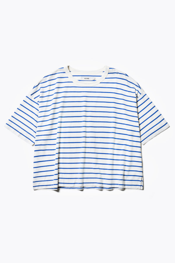 This boxy relaxed tee is a great wardrobe staple. Cut in a soft organic cotton jersey in blue and white stripes, with a thick 1 x 1 rib bound cover stitched neckline and straight hem.