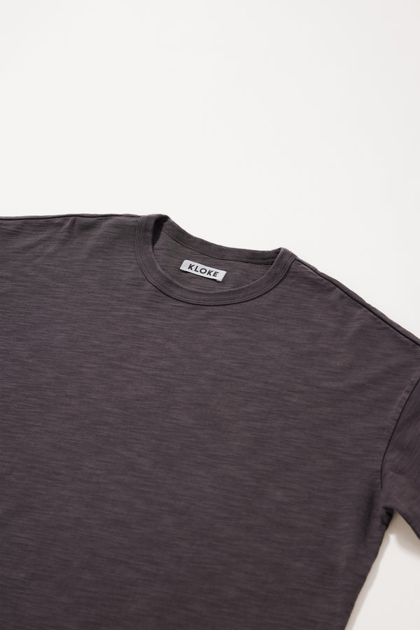 Close-up of the soft pigment-dyed cotton fabric showing its subtle texture.