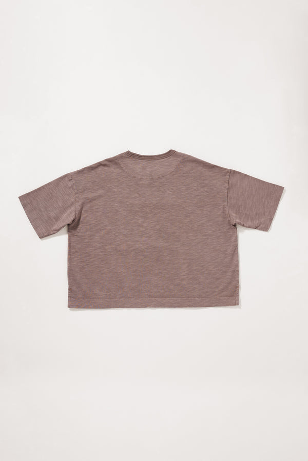 Flat Back view of the brown Obelisk Tee showing the relaxed boxy silhouette.