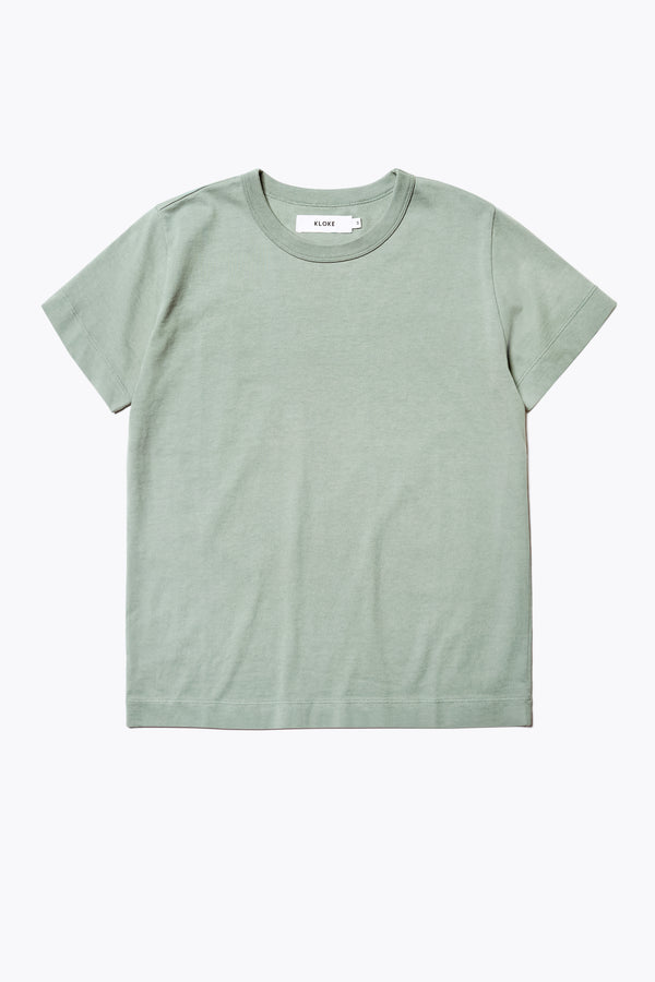 The Oceania Tee, a fitted style t-shirt cut from premium organic cotton jersey in Sage green. Available in five sizes. 