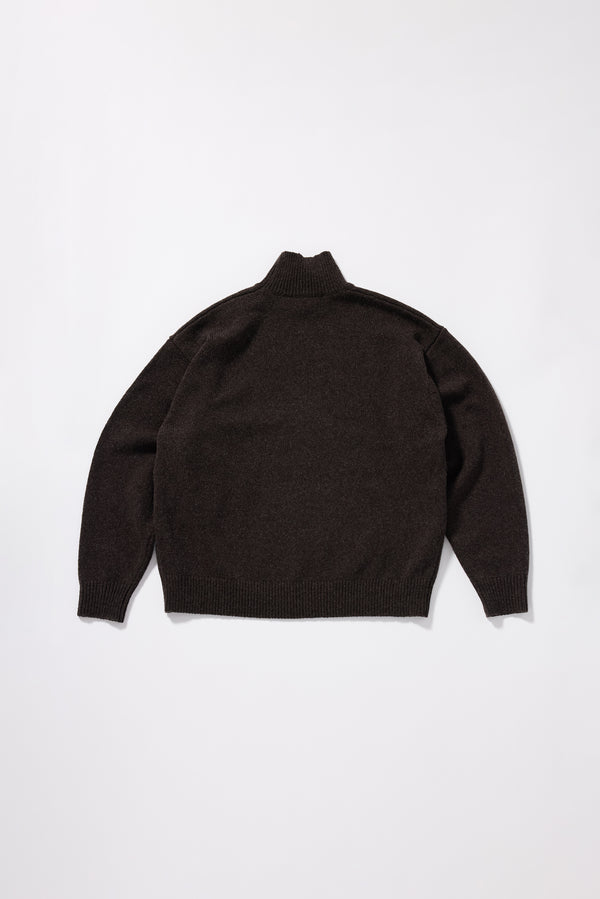 Back view of the Opal Mock Neck Sweater in Coffee showing relaxed shorter silhouette and dense structured extrafine Merino knit