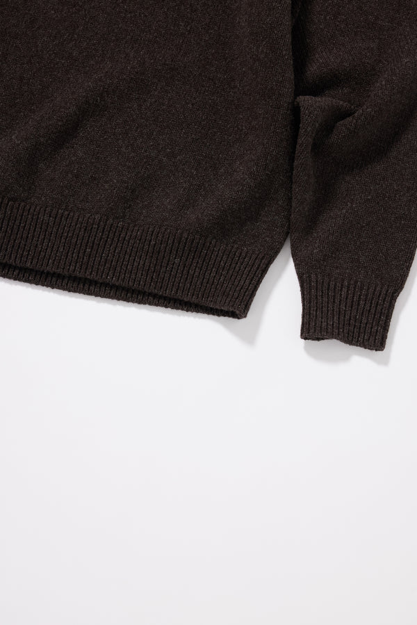 Close-up of dense structured knit texture showing subtle yarn fleck on the Opal Mock Neck Sweater in Coffee extrafine RWS Merino