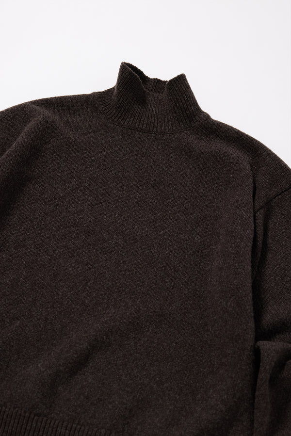 Close-up of the elegant 1x1 rib mock neckline on the Opal Sweater in Coffee extrafine Merino