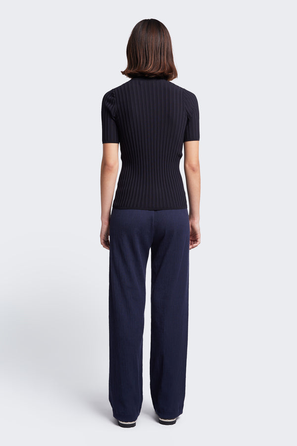 The back of the Oracle Crinkle Pant Ink, a slinky, slim fit pant made from a special crinkle fabrication. This refined style is the perfect evening option.