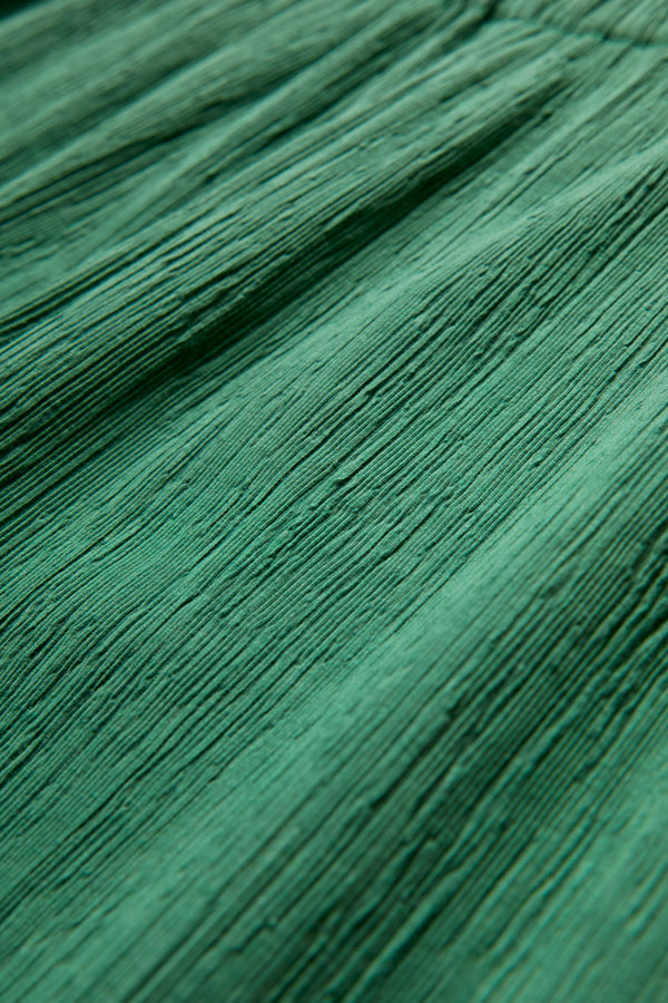 Close up of the special crinkle fabric green for the Oracle Crinkle Pant. 