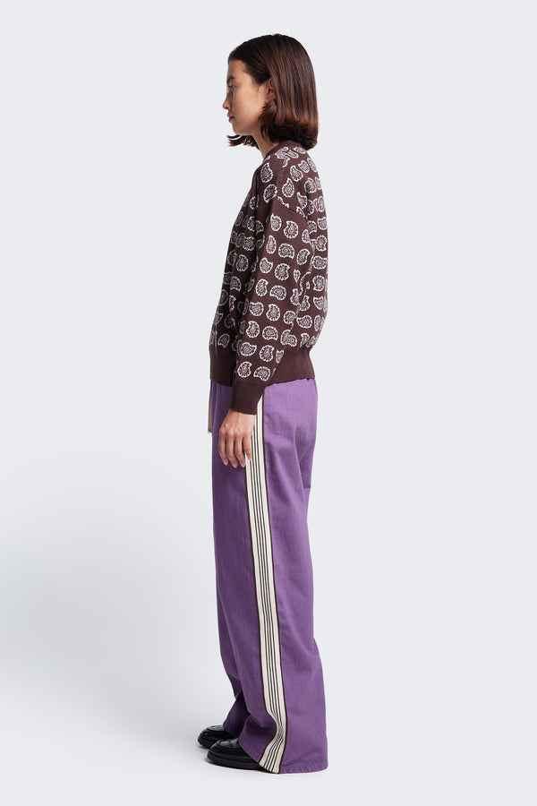 Side profile of the Paisley Knit Sweater, a relaxed boxy style jumper made from cotton. Features rib detail at the neck, cuff and hem. 