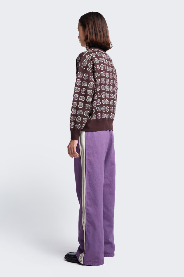 The back of the model wearing the Paisley Knit Sweater, a relaxed boxy style jumper. Made from cotton, this sweater features rib detail at the neck, cuff and hem.