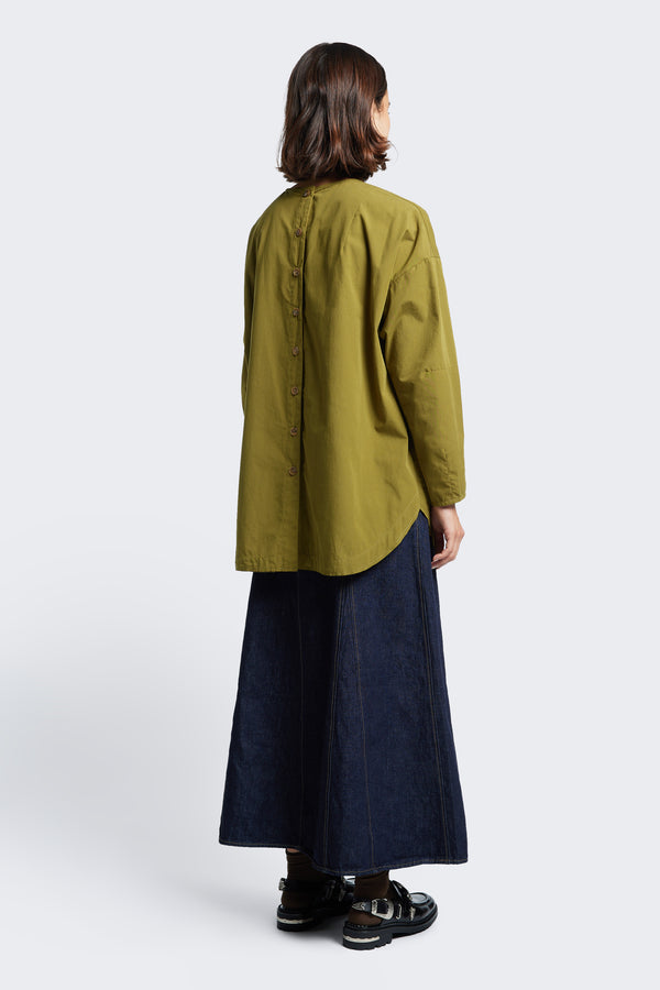 The back of the Plateau Blouse Moss Green features a button through back placket and rounded scoop hem.